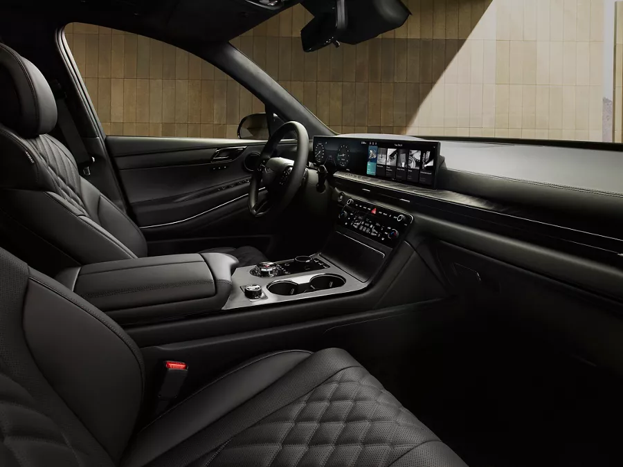Front interior passenger POV of front seating in the Genesis GV80 in Prestige Black