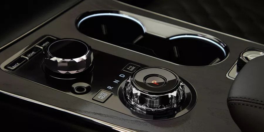 Interior close up of center console details inside Genesis GV80 in Prestige Black