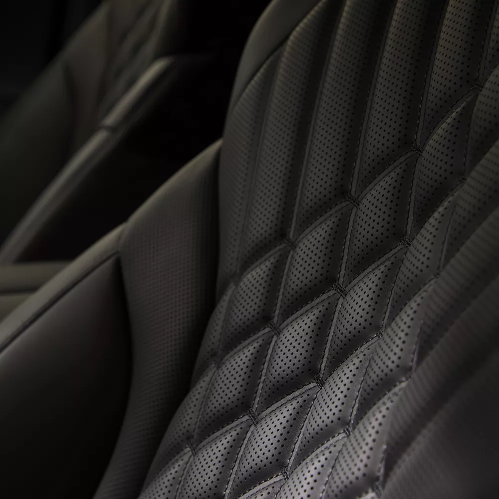 Interior close up of the black perforated Nappa leather seating in the Genesis GV80 Prestige Black