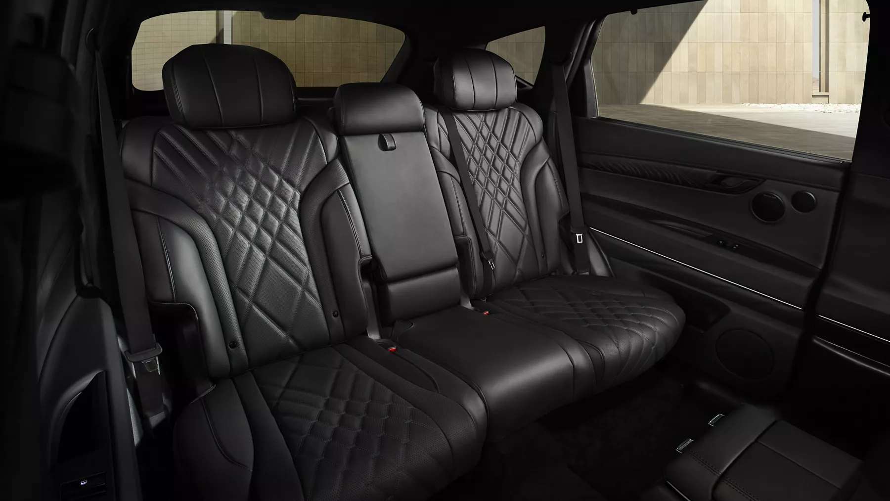Interior view of rear seating in Black perforated Nappa leather inside Genesis GV80 Prestige Black
