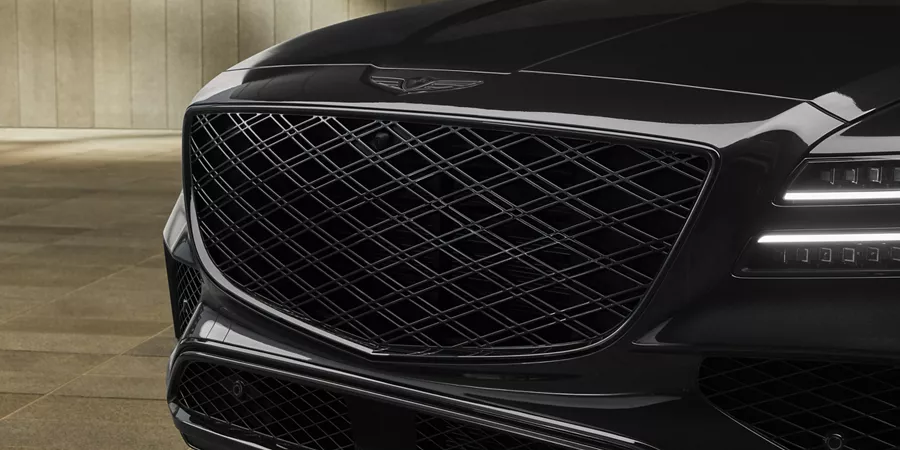 Close up of hood and grille details on the Genesis GV80 Prestige Black