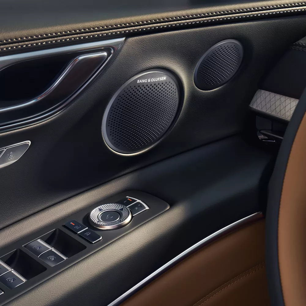 Close up of interior door panel details inside Genesis GV80