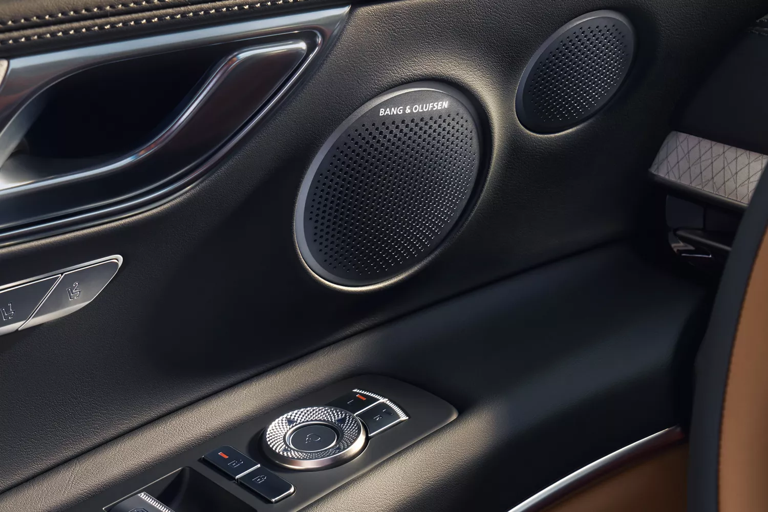 Close up of interior door panel details inside Genesis GV80