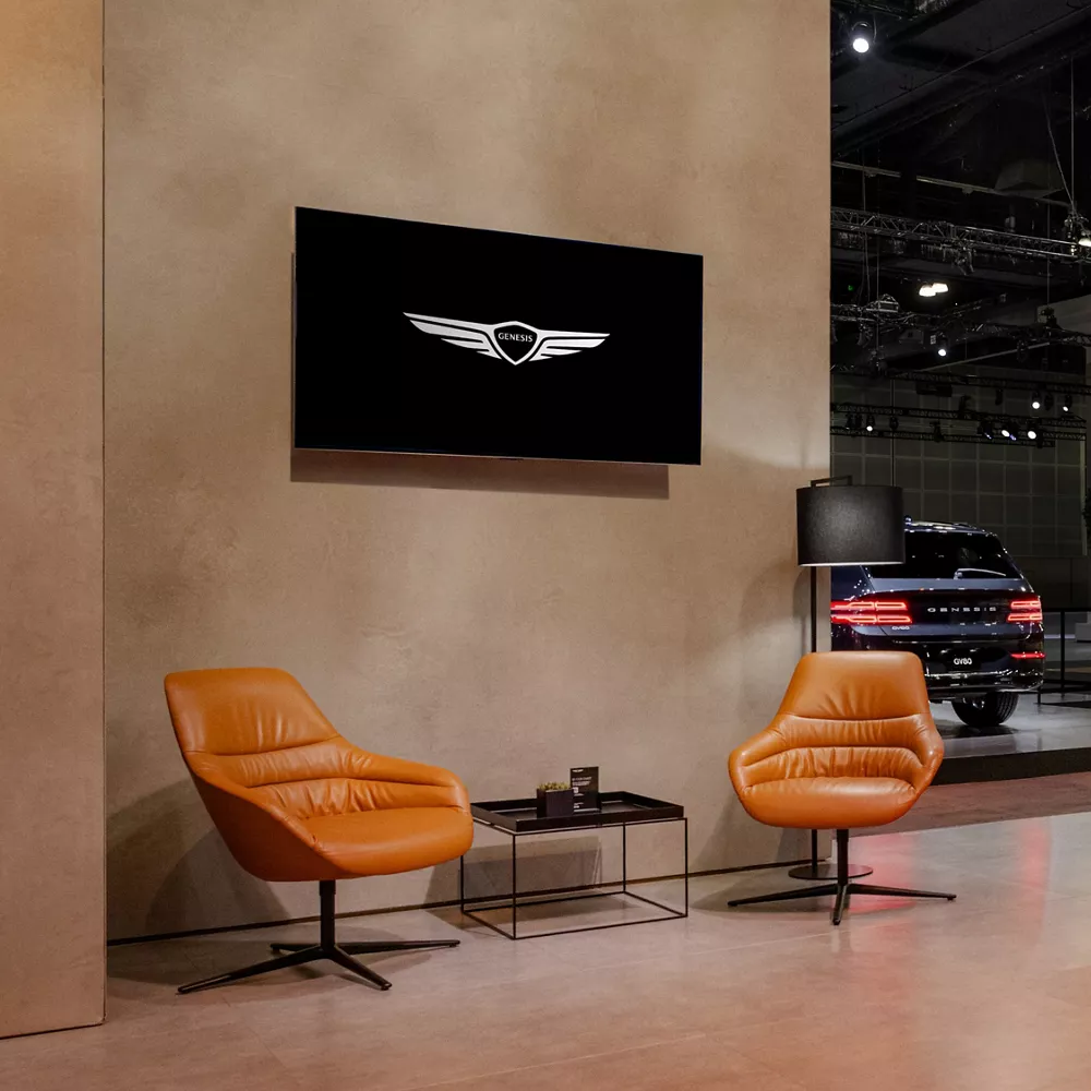 The Genesis Lounge at the 2025 LA Auto Show with Genesis vehicles on display