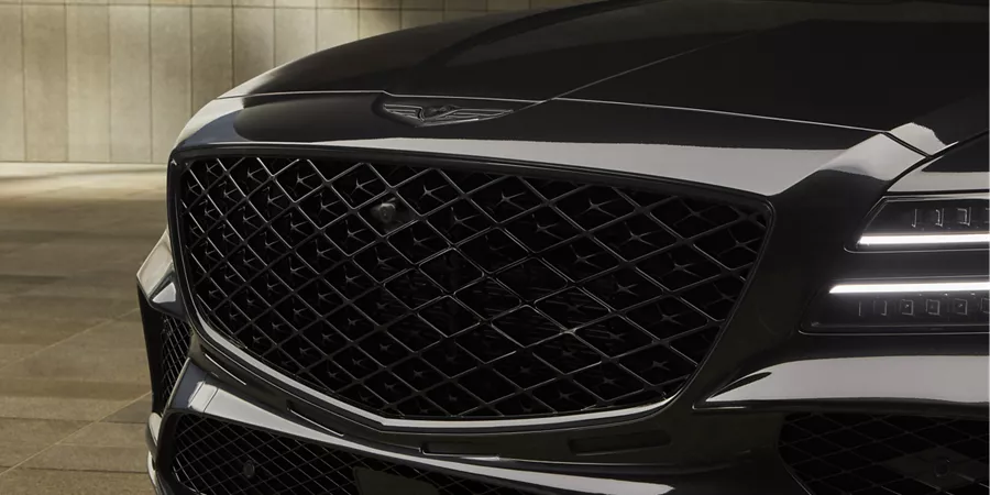 Close up of grille and headlight details on 2026 Genesis GV80 Coupe Prestige Black