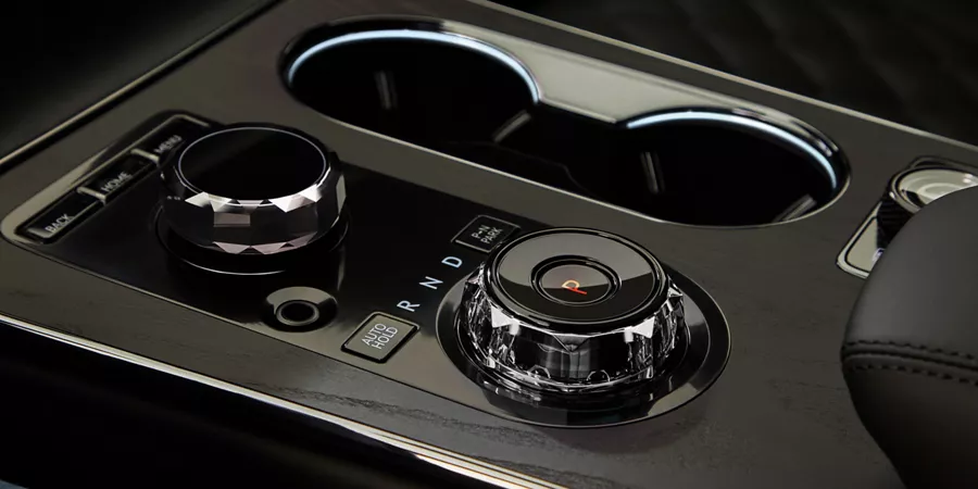 Interior closeup of gear shift knob on center console of Genesis GV80 Coupe