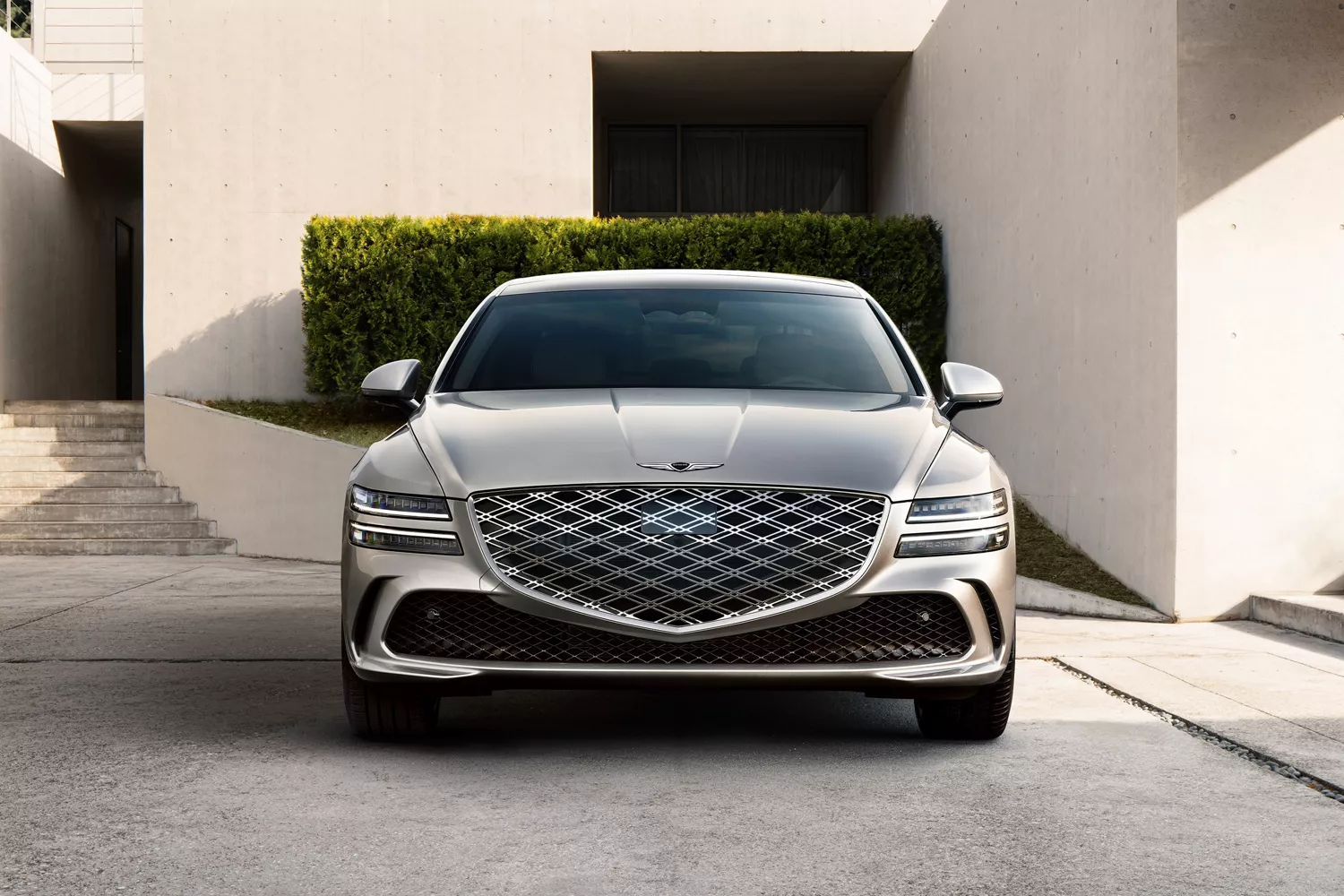 Front view of Genesis G80 parked in front of modern home