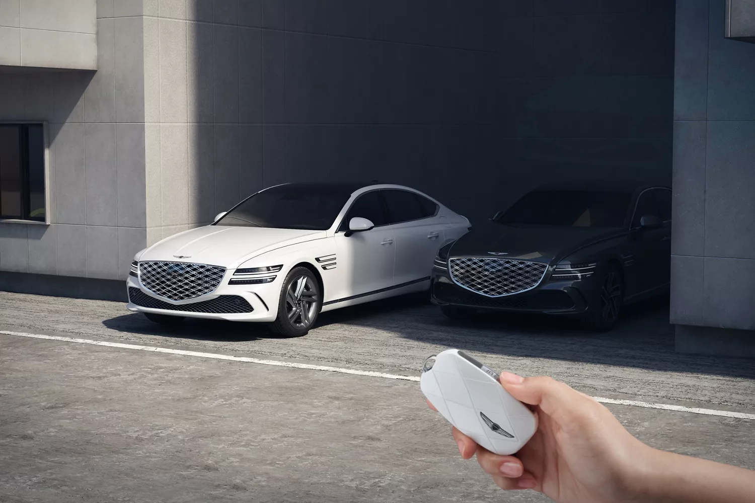 Genesis G80 in Uyuni White parked beside black G80, remote key in foreground near modern garage