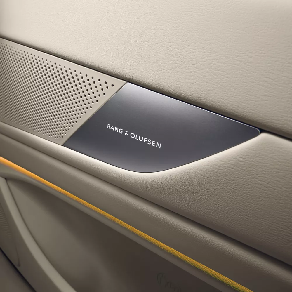 Close up of Bang & Olufsen speaker system in beige interior door of Genesis G80