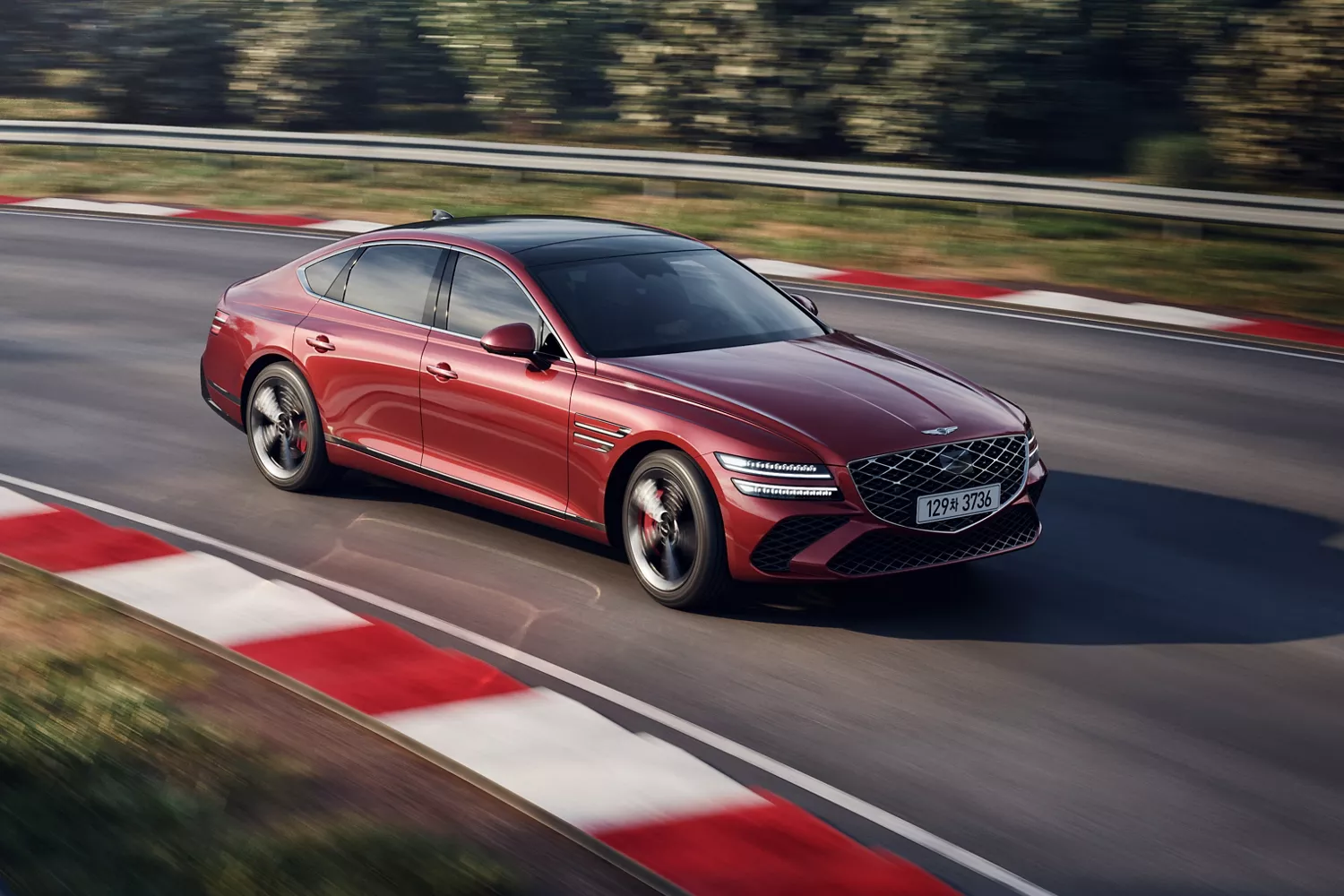 Cavendish Red Genesis G80 driving on racetrack, highlighting agility and handling performance