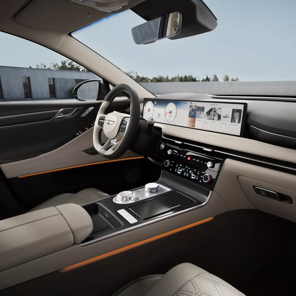Genesis G80 interior with Ash Gray and Vanilla Beige leather, wide digital display and refined center console