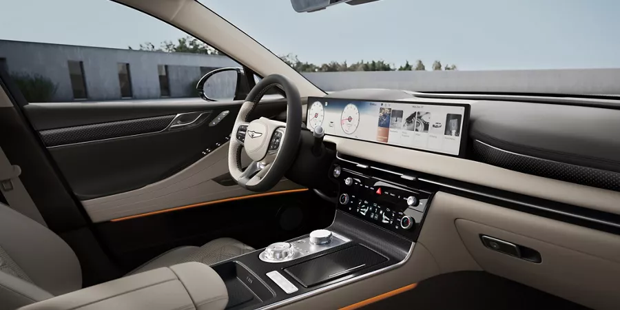 Genesis G80 interior with Ash Gray and Vanilla Beige leather, wide digital display and refined center console