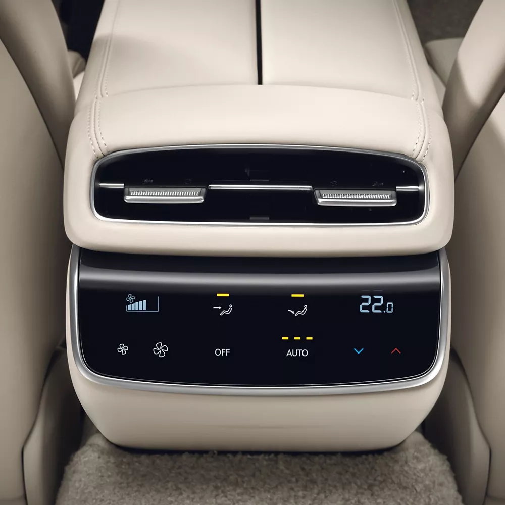 Rear passenger seat close-up of Genesis G80 climate control panel with digital display and air vents