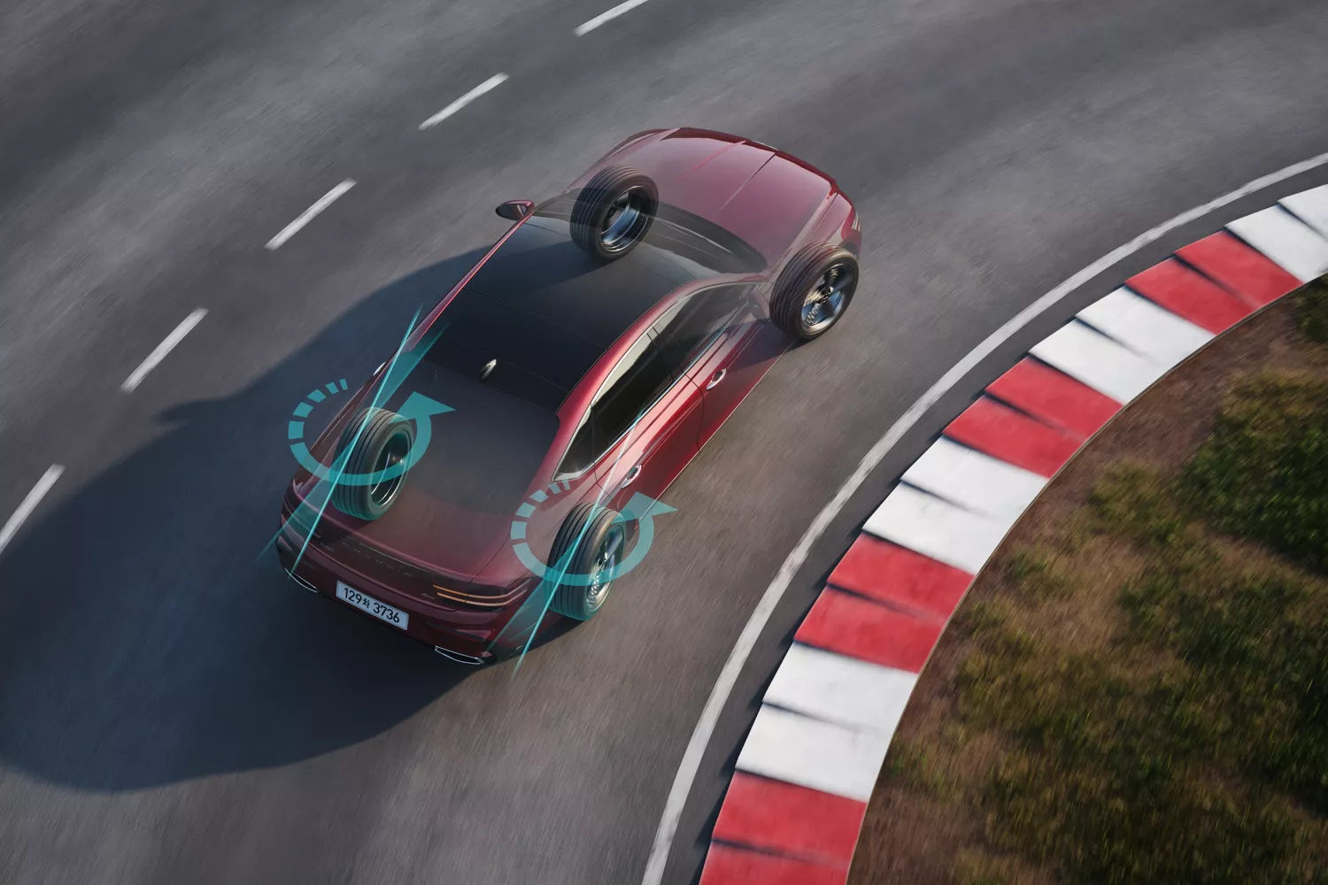 Aerial view of Genesis G80 in Cavendish Red demonstrating rear wheel steering on curved track