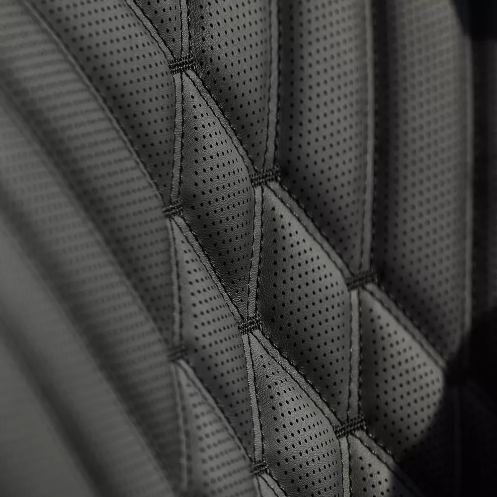 Interior closeup black quilted nappa leather seating detail inside Genesis G80 Prestige Black