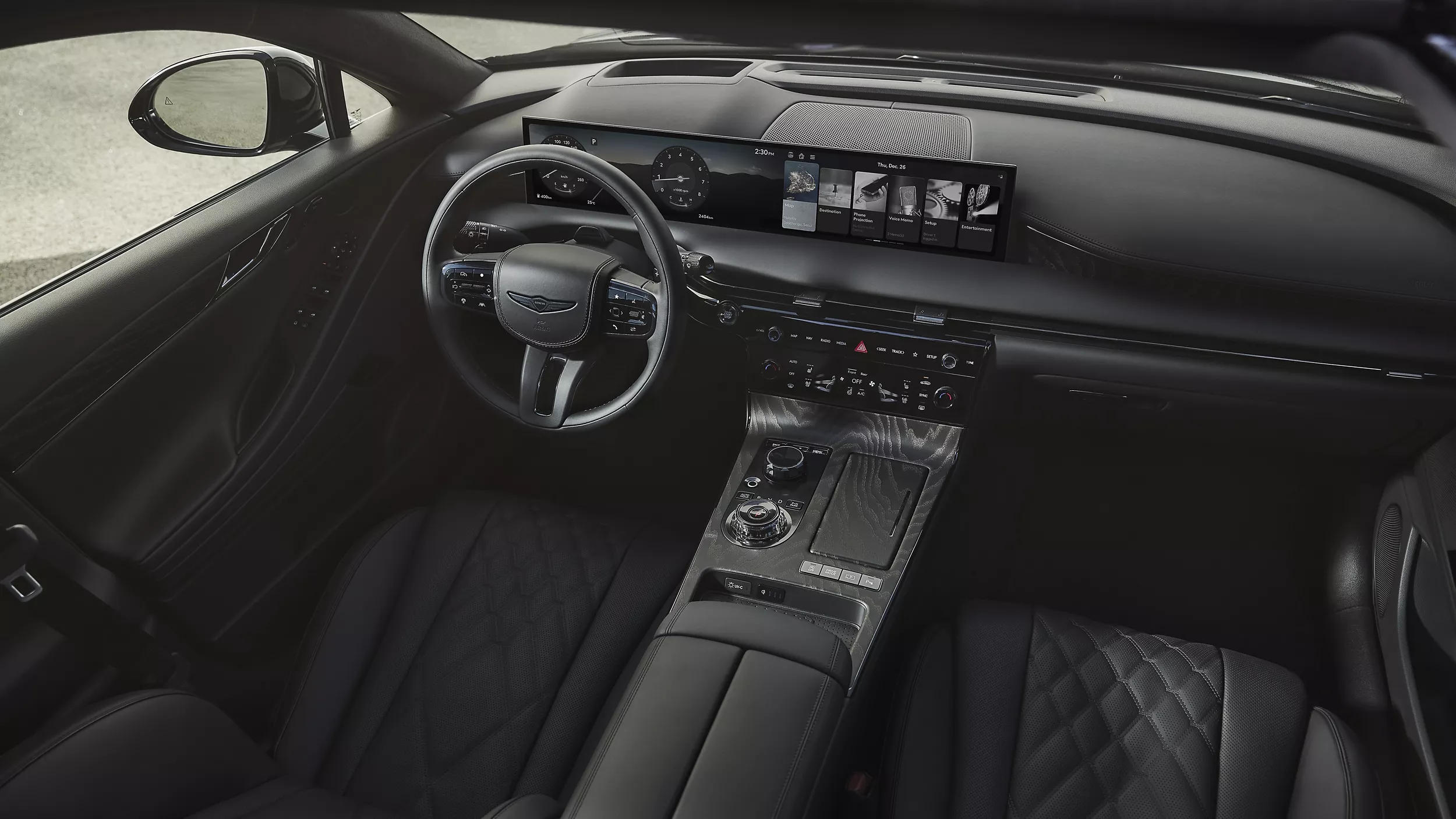 Overhead interior view of front seats and steering wheel in 2026 Genesis G80 Prestige Black