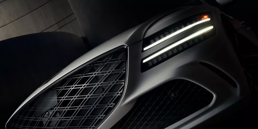 Close-up of black alloy wheel on 2026 Genesis Prestige Black vehicle
