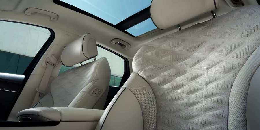 Interior view of sunroof and front seats from driver seat pov inside the Genesis G80