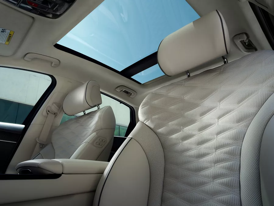 Interior view of sunroof and front seats from driver seat pov inside the Genesis G80