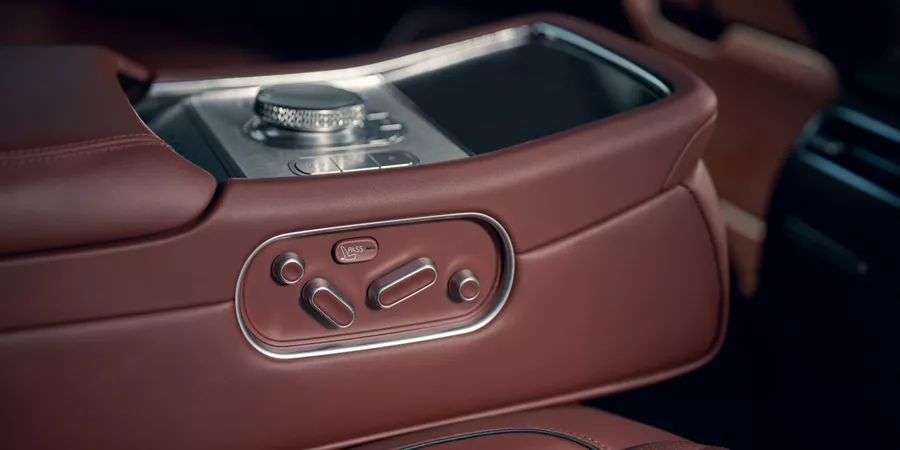 Close up of interior seating control panel in Bordeaux brown inside 2026 Genesis G90