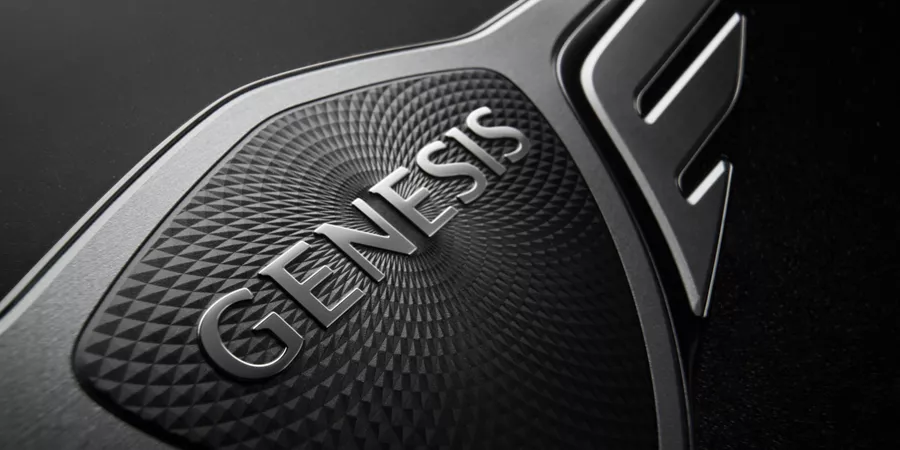 Close up of Genesis logo on steering wheel of 2026 Genesis G90 in Prestige Black