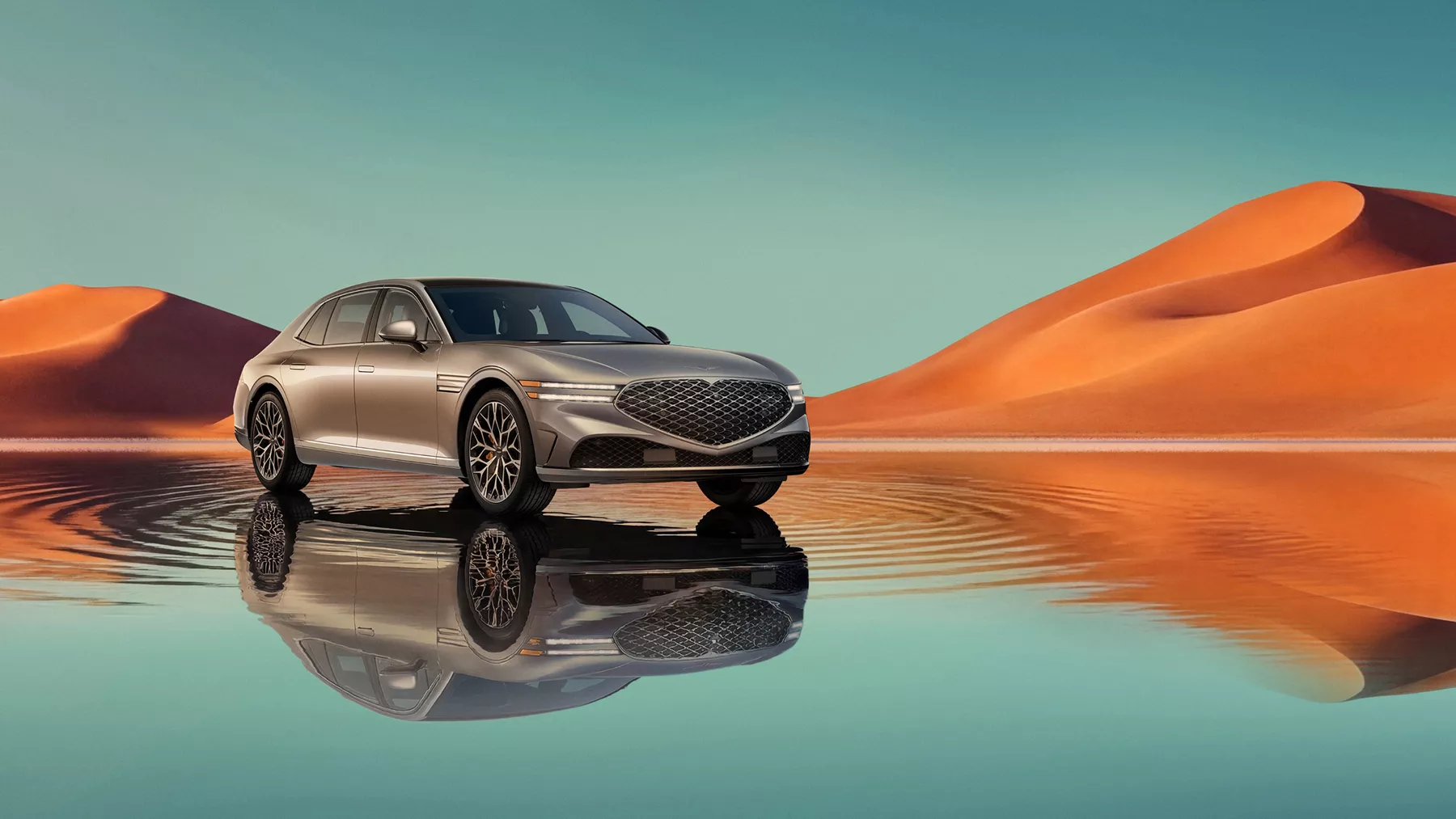 7/8 front passenger view of Savile Silver Genesis G80 on blue lake w/ orange mountain in background
