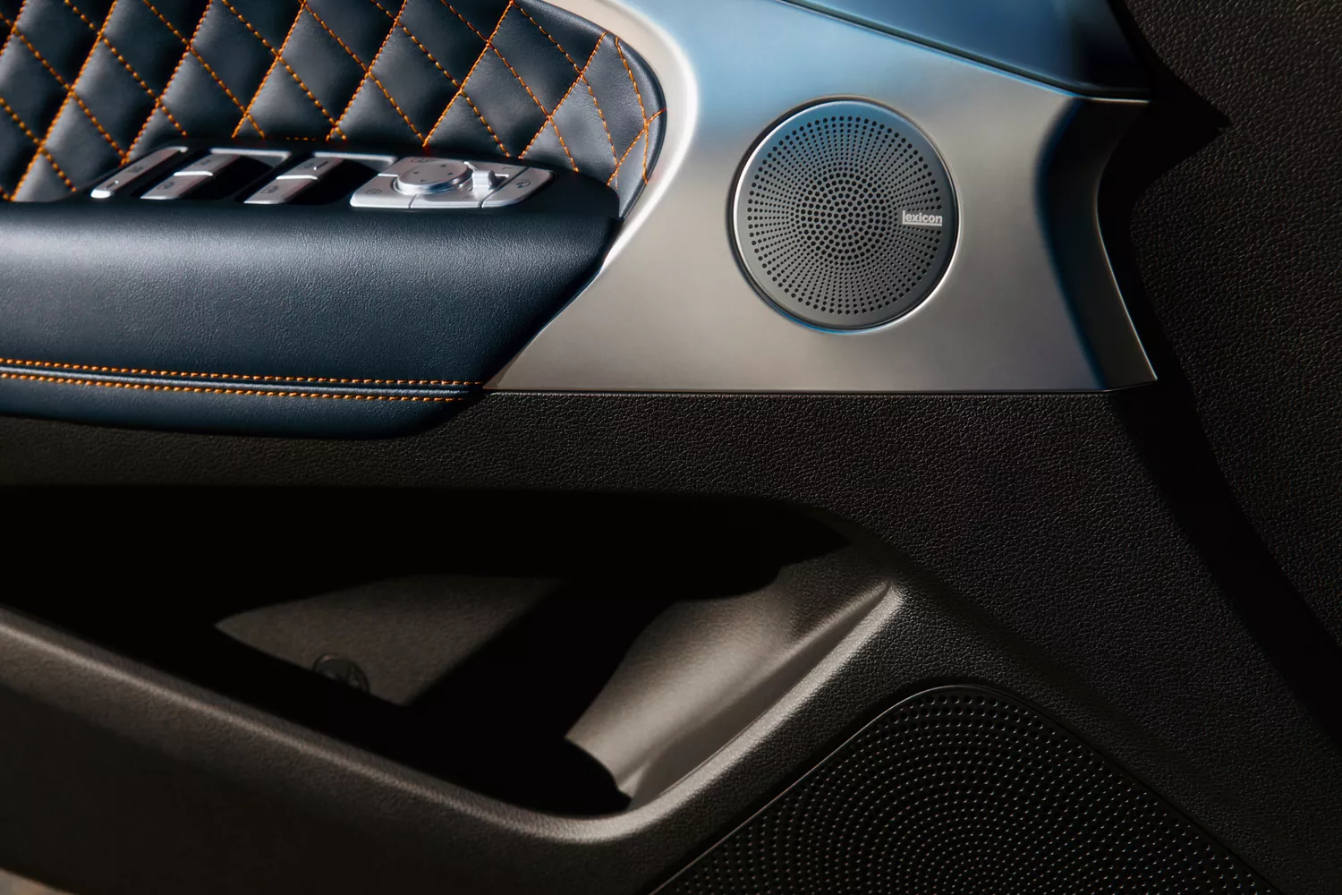 Interior close up of Lexicon premium audio speaker on door panel inside 2027 Genesis G70