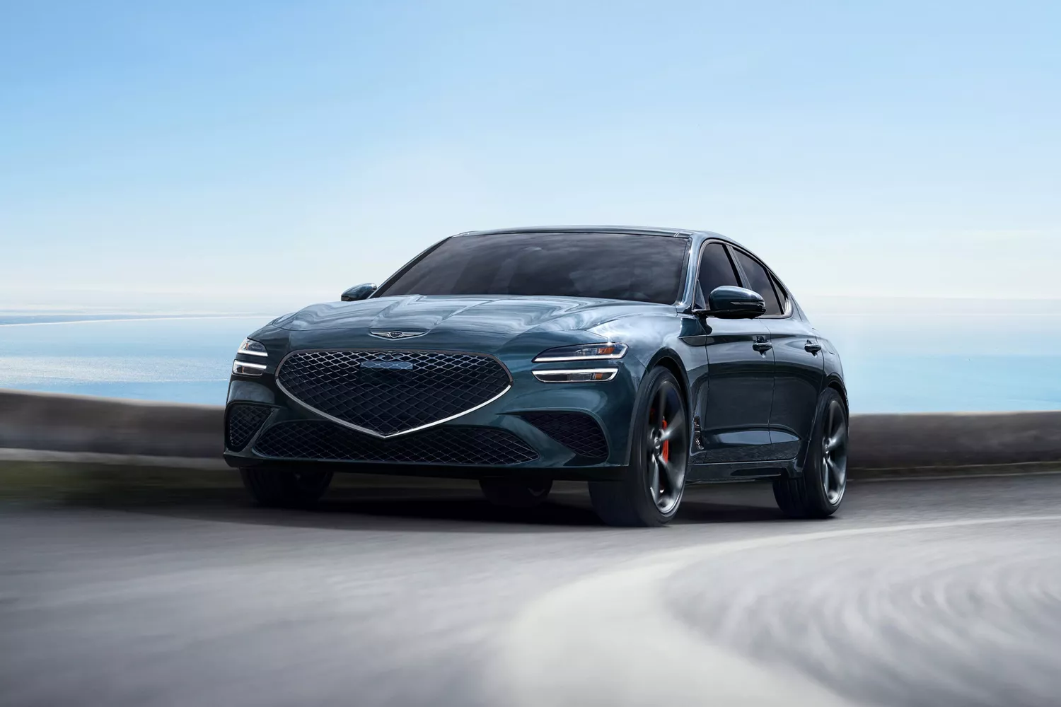 3/4 front driver side view of 2027 Genesis G70 in Tasman Blue in motion driving on a track