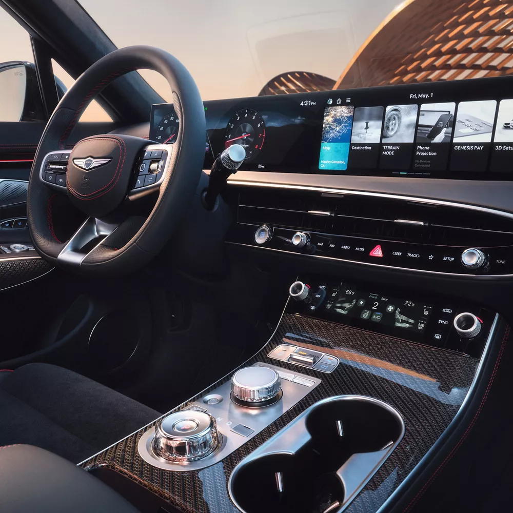 Interior view from passenger seat of Genesis GV70 cockpit in Ultramarine Blue Nappa leather