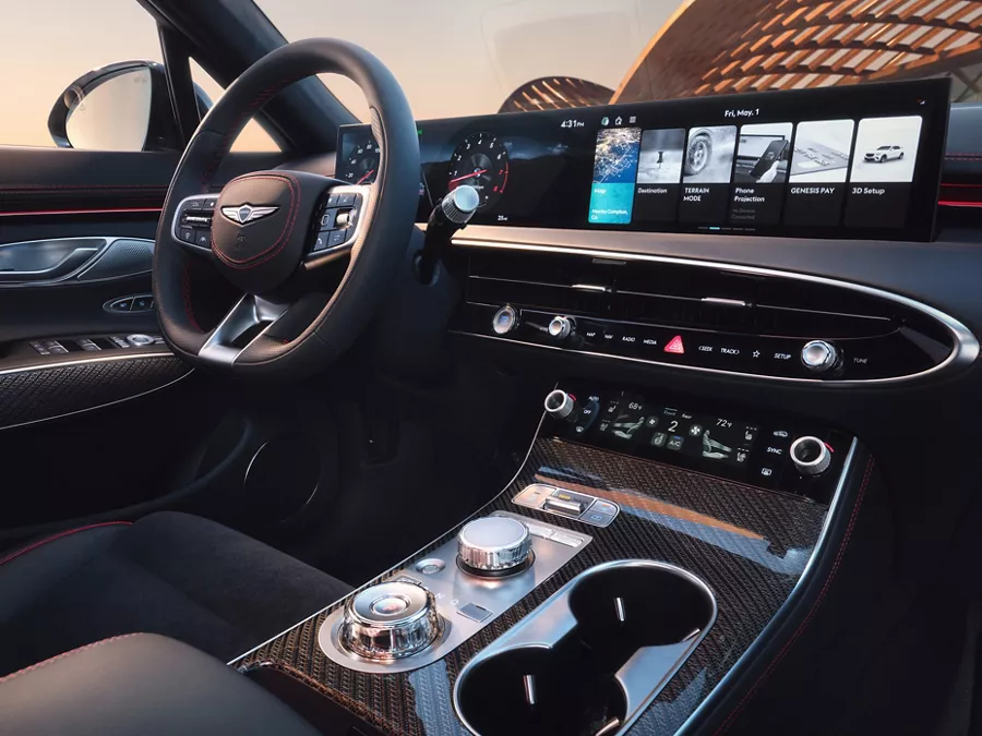 Interior view from passenger seat of Genesis GV70 cockpit in Ultramarine Blue Nappa leather