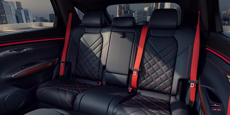 Genesis GV70 interior shot of quilted Nappa leather backseats in ultramarine blue & orange accents