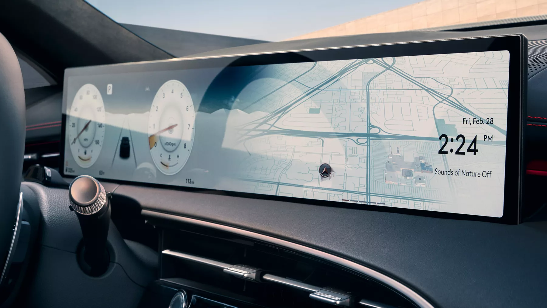 Interior close up of Genesis GV70 infotainment screen displaying odometer and navigation