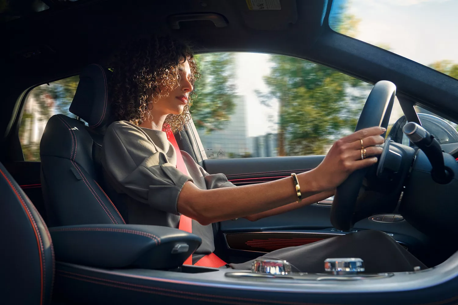 View from passenger seat of driver operating Genesis GV70