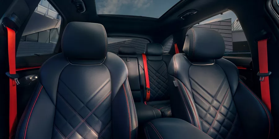 Interior view of front and rear Ultra-Marine Blue nappa leather seats inside Genesis GV70
