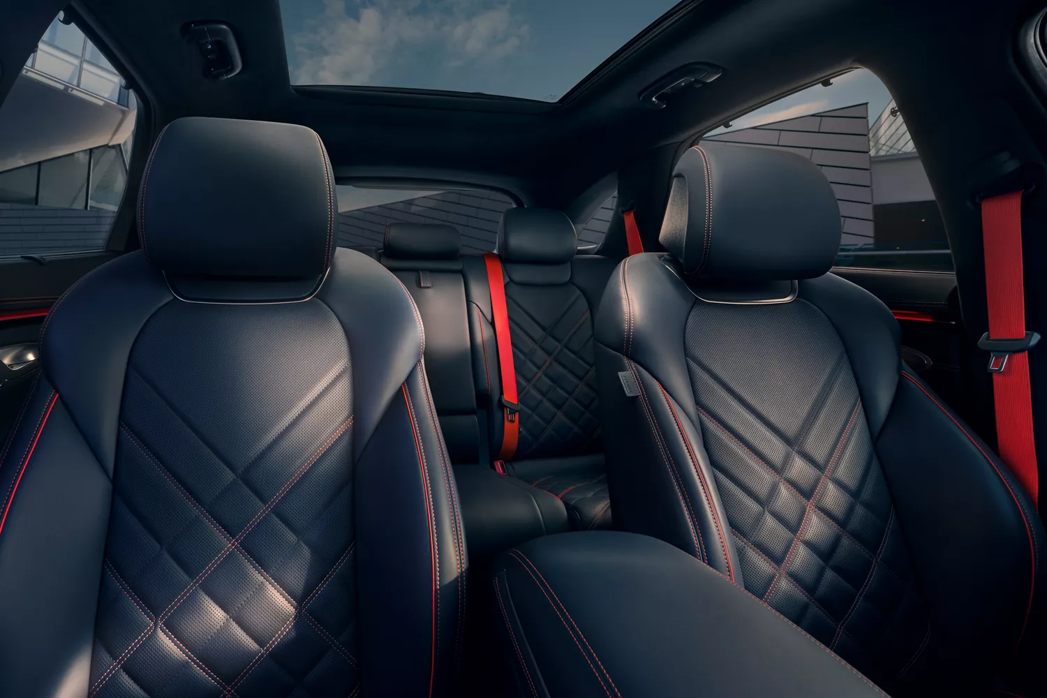 Interior view of front and rear Ultra-Marine Blue nappa leather seats inside Genesis GV70