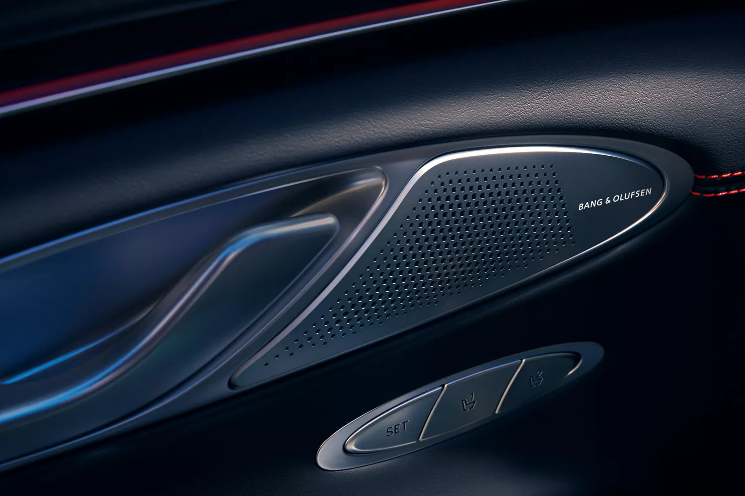 Interior close-up of Bang & Olufsen speaker on driver side door panel inside Genesis GV70