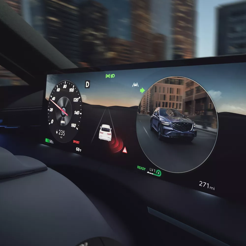 Interior close-up of digital cluster showing blind spot view assist inside Genesis Electrified GV70