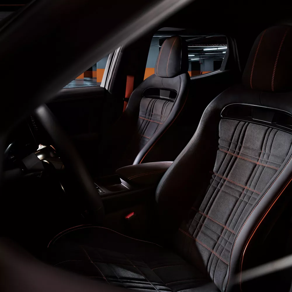 Interior view from opened driver side door of 2027 Genesis GV60 Magma cockpit