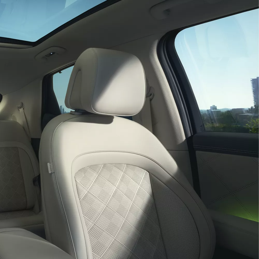 Interior close up of driver's seat in Ash Gray, inside Genesis GV60