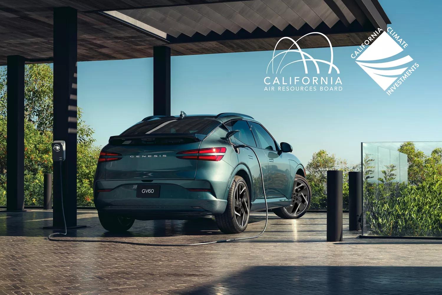 3/4 rear passenger side view of Genesis GV60 in Tromso Green, connected to charging station