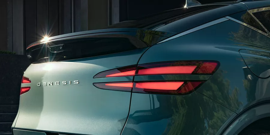 3/4 rear passenger side close up of Genesis GV60 in Trumso Green