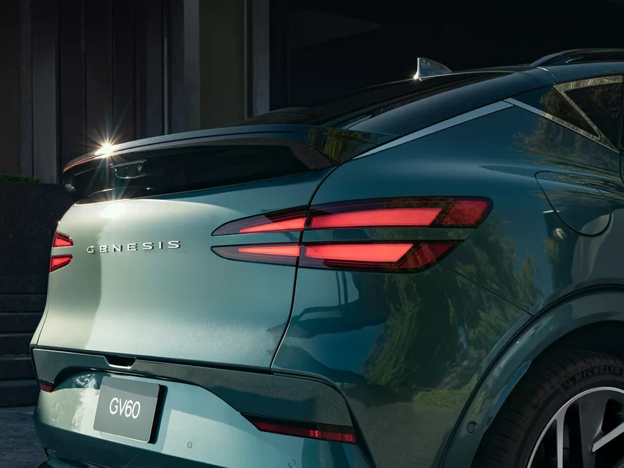 3/4 rear passenger side close up of Genesis GV60 in Tromso Green