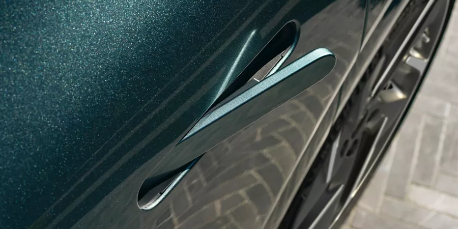Close up of door handle on Genesis GV60 in Trumso Green