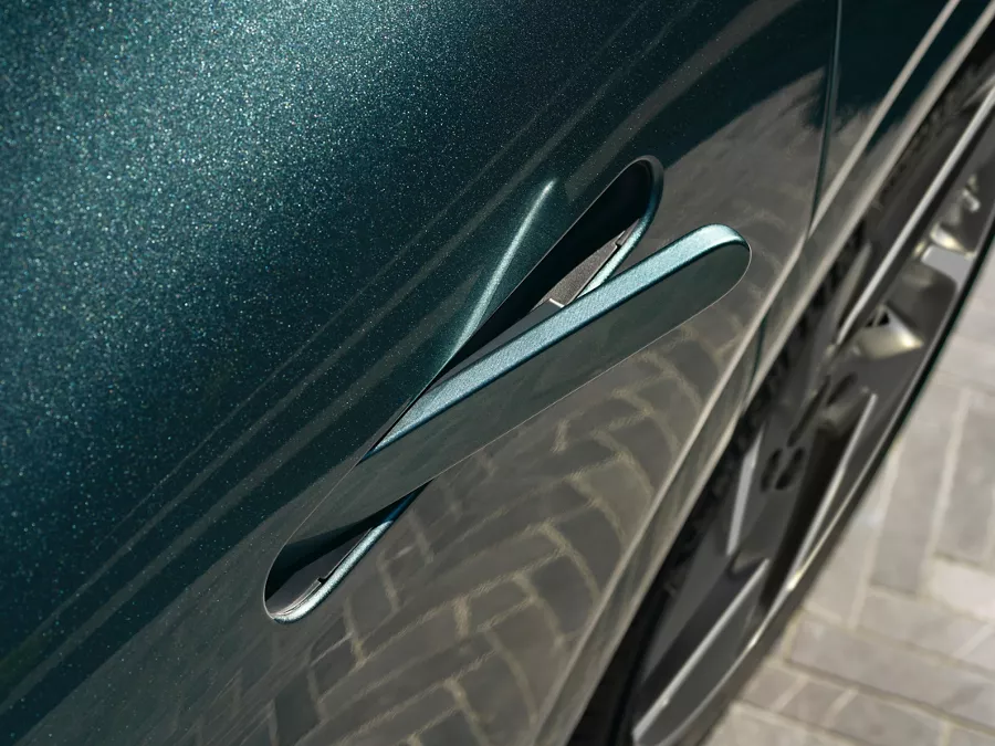 Close up of door handle on Genesis GV60 in Tromso Green
