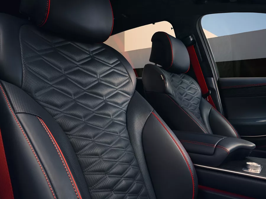 Interior close up of Genesis GV80 Coupe Nappa leather seating in Ultramarine Blue & Orange Stitching