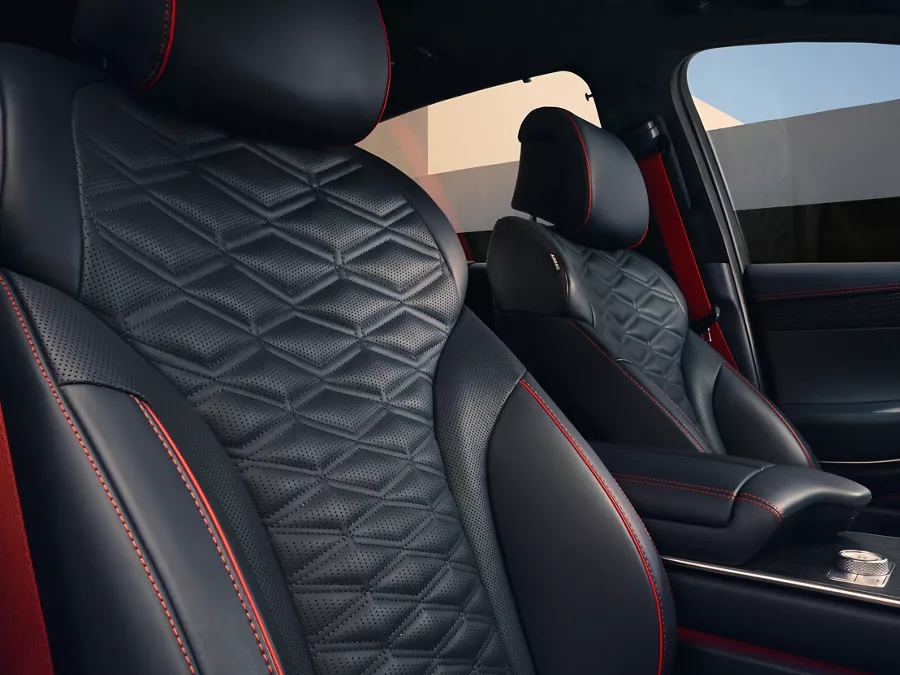 Interior close up of Genesis GV80 Coupe Nappa leather seating in Ultramarine Blue & Orange Stitching