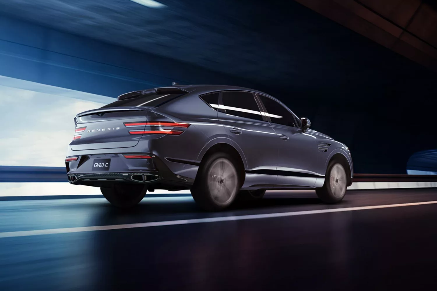 7/8 rear passenger side view of Genesis GV80 Coupe in Ceres Blue driving through a tunnel
