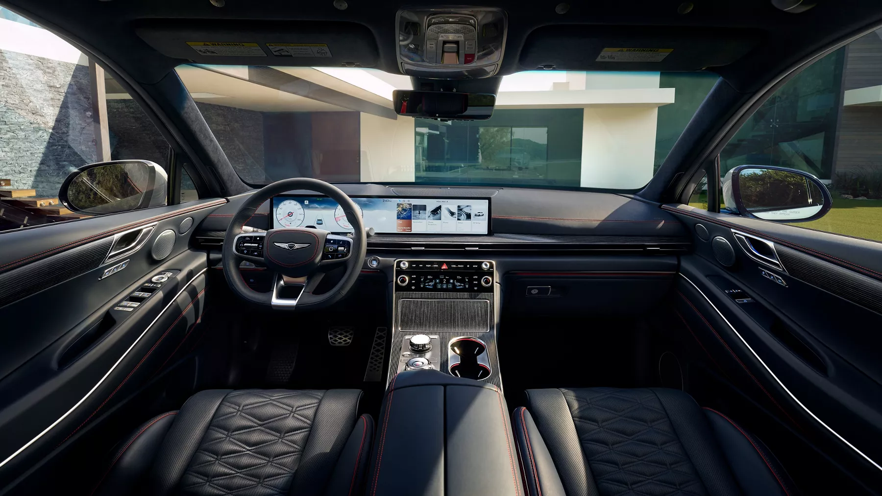 Interior view of Genesis GV80 Coupe from rear-seats of cockpit, leather seats and digital dash