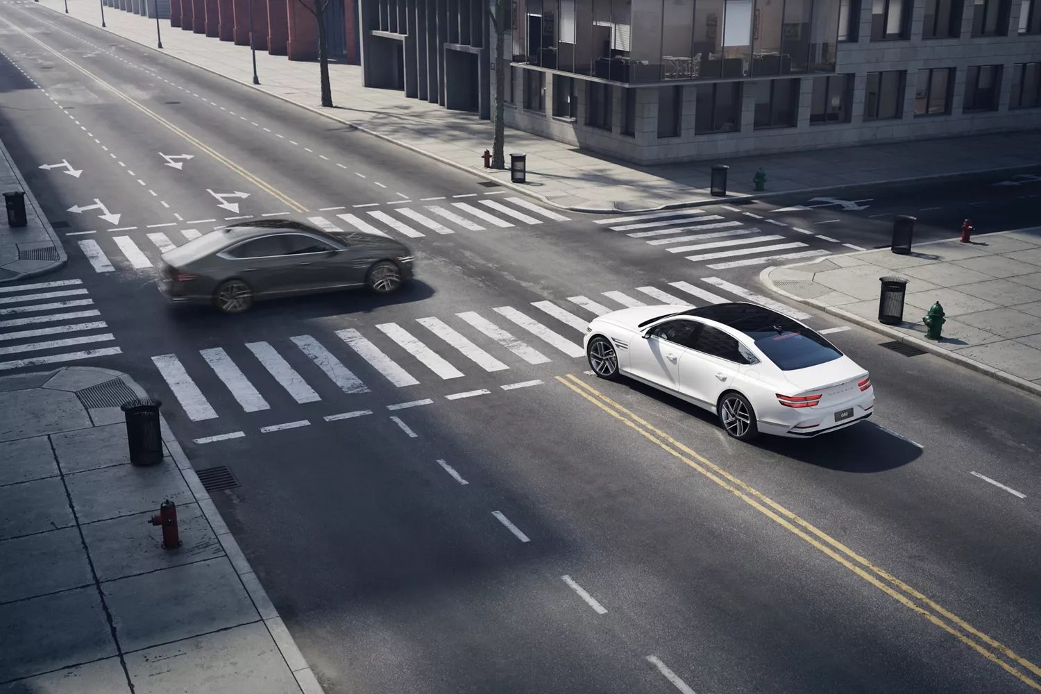 Rear driver side view of white Genesis G80 crosses city intersection, black car drives perpendicular