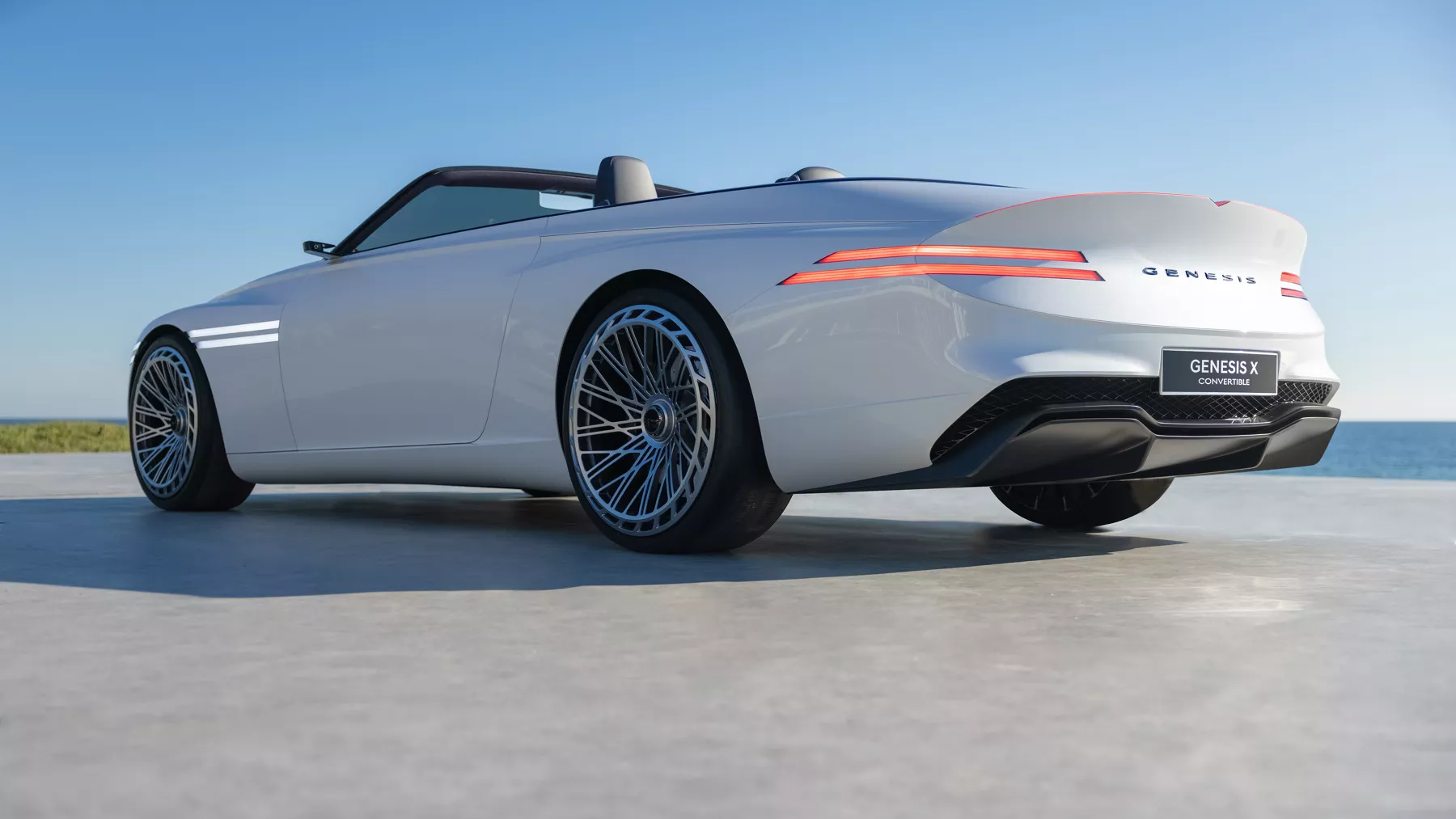 Rear view of a parked X Convertible Concept with a blue sky overhead.